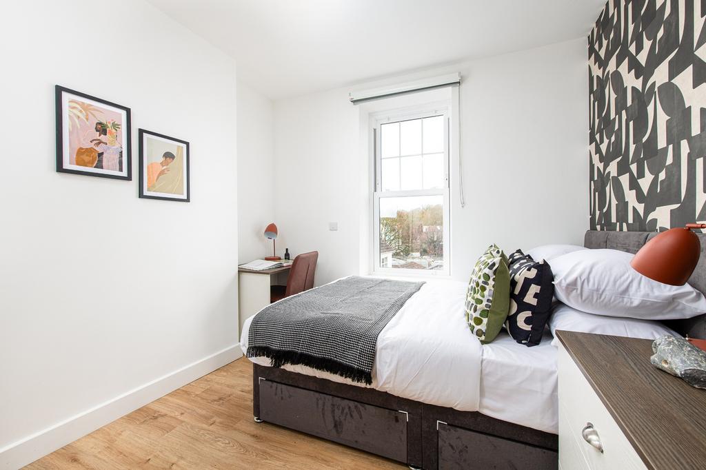A beautifully decorated double bedroom featurin...