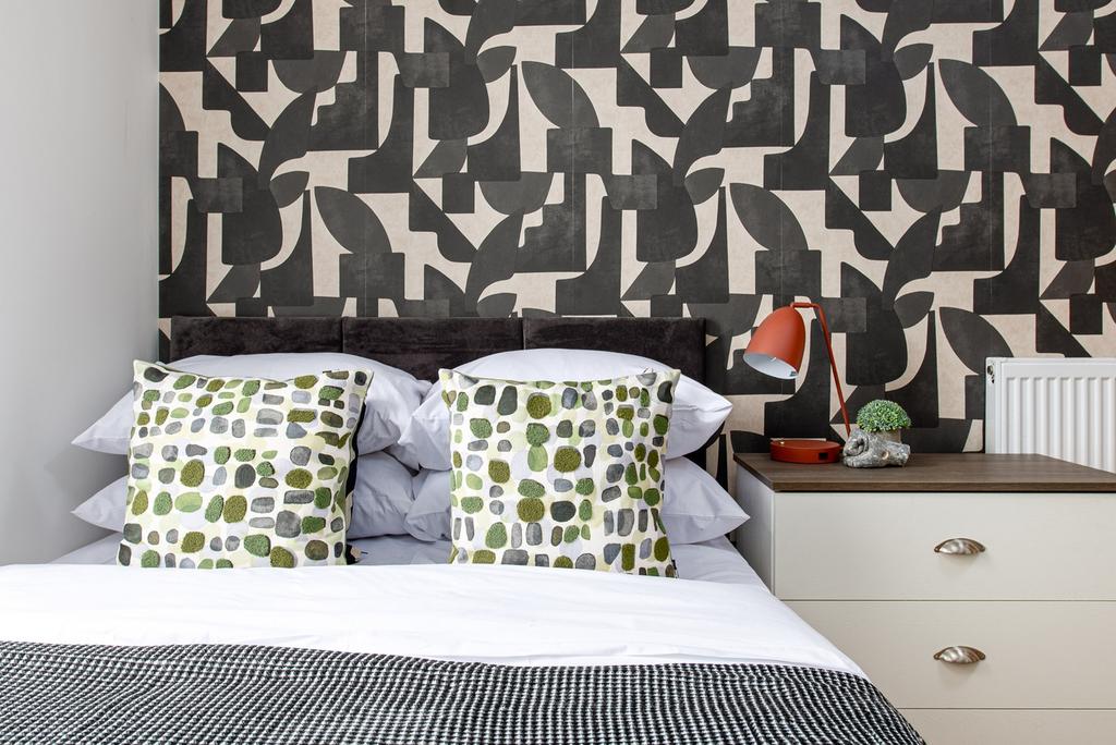 A beautifully designed double bedroom featuring...