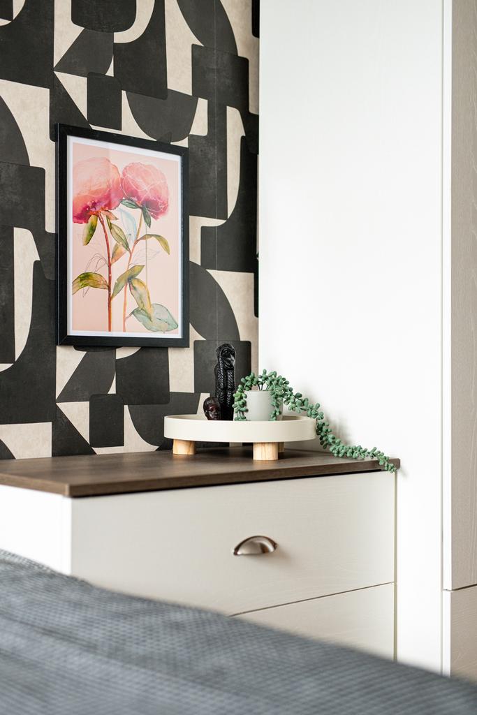 This charming double bedroom features an elegan...