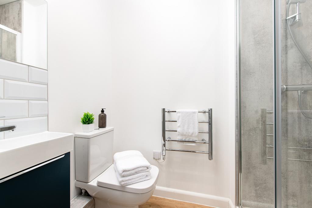 A modern bathroom featuring a sleek design with...