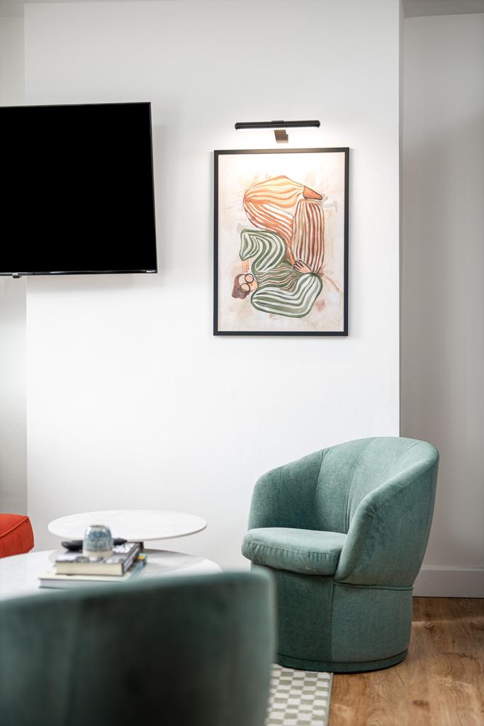 A stylish and inviting living room featuring co...
