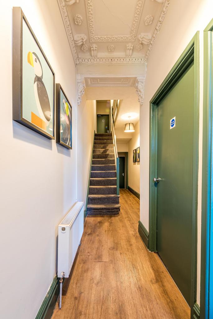 This stylish hallway features elegant ceiling d...