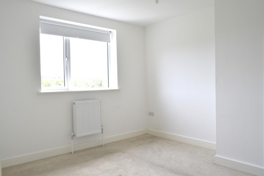 Bright and airy double bedroom featuring a larg...