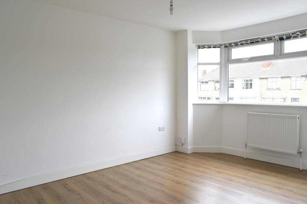 Spacious double bedroom featuring large windows...