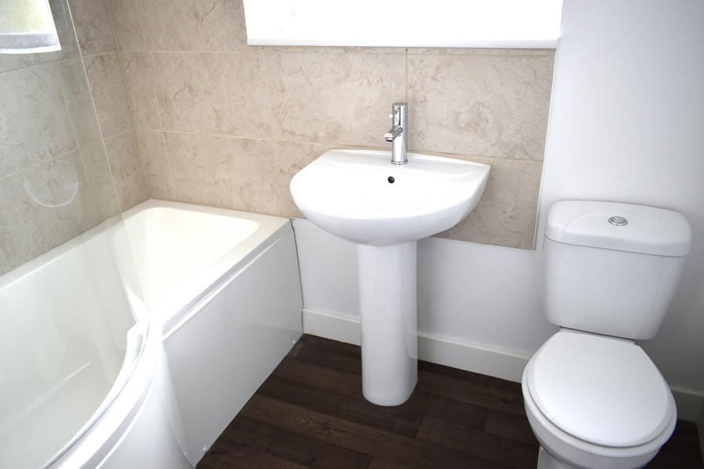 Bright and modern bathroom featuring a sleek de...