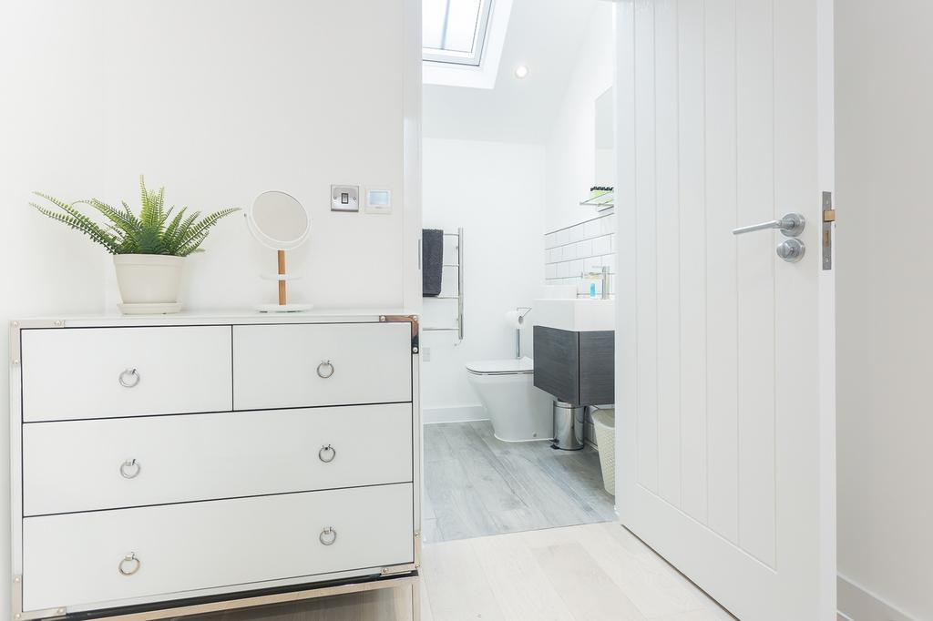 A bright and modern bathroom featuring sleek de...