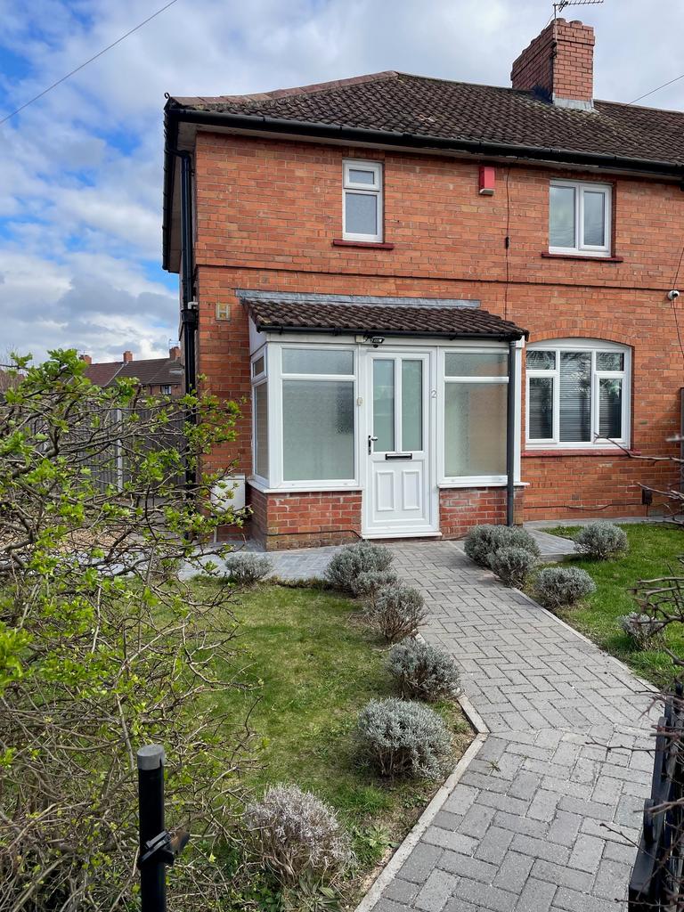 Charming front view of a well-maintained semi-d...