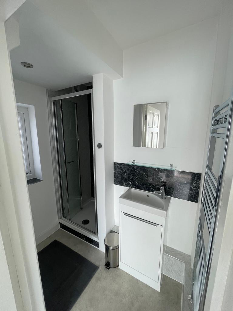 Modern bathroom featuring a sleek shower, styli...