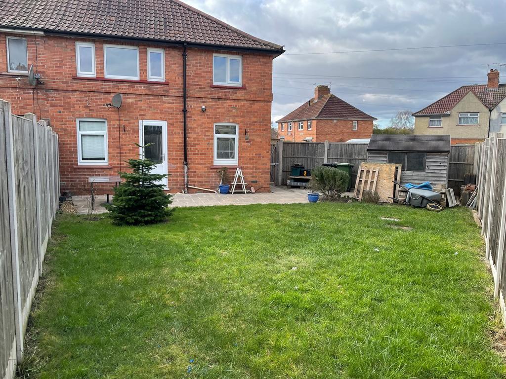 Charming garden space featuring a well-maintain...