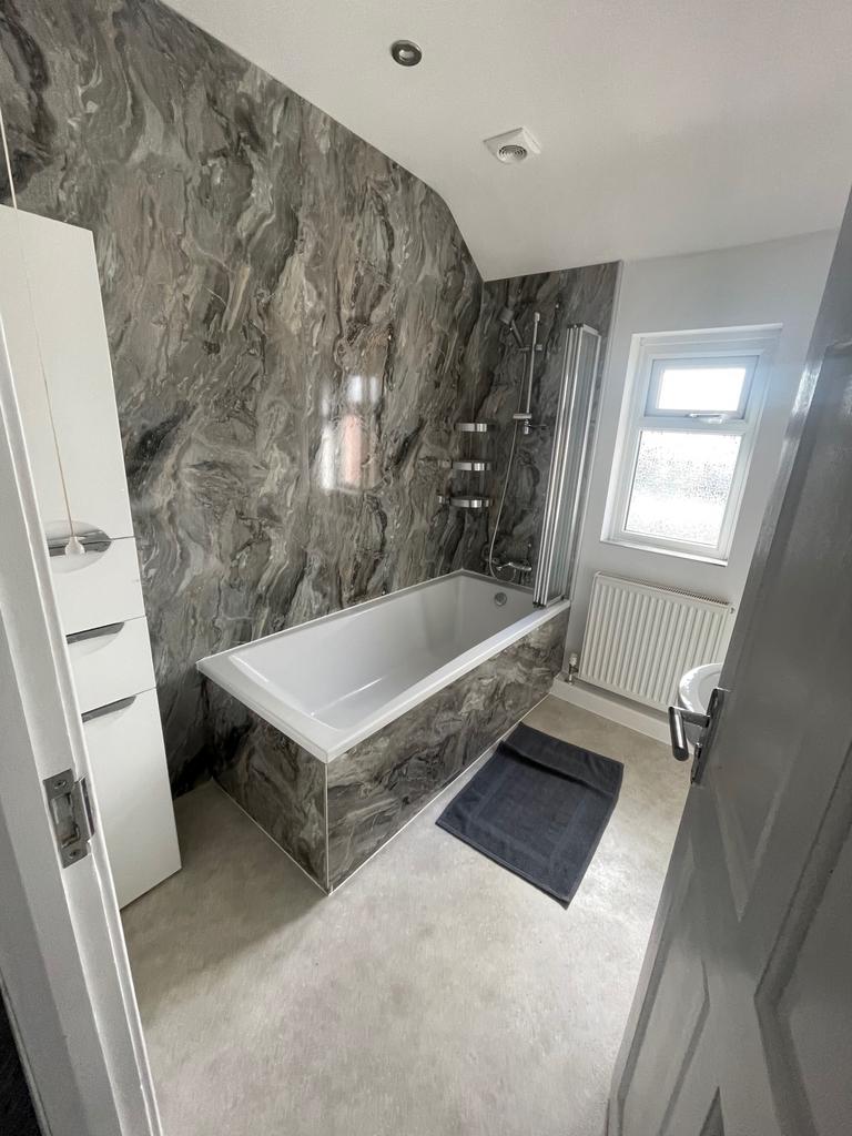 Experience a luxurious bathroom suite featuring...