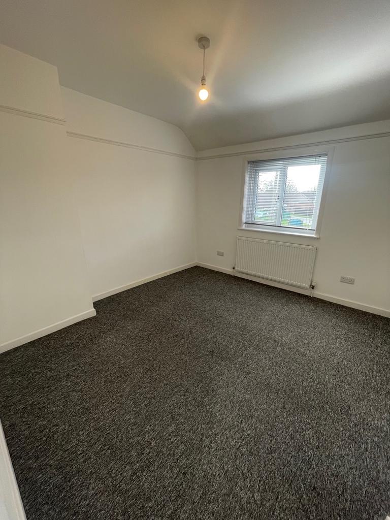 A bright and spacious double bedroom with ample...