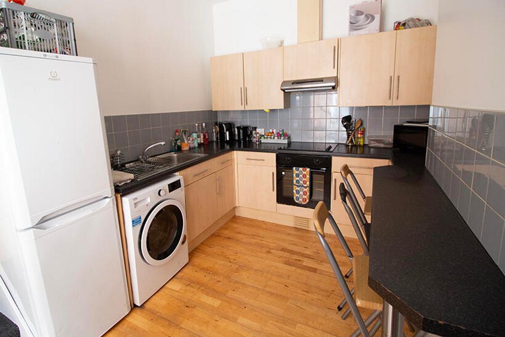 Stylish kitchen featuring modern appliances, am...