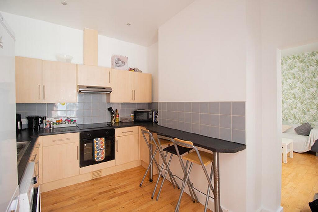 This well-appointed kitchen features modern cab...