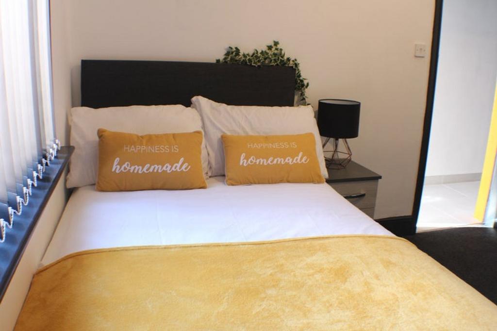 This charming double bedroom features a cozy at...