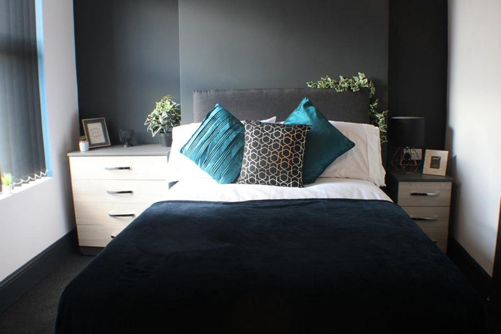 This elegantly designed double bedroom features...