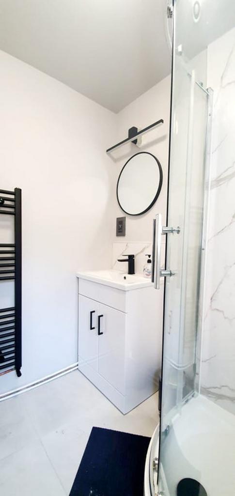 A modern bathroom featuring a sleek design with...