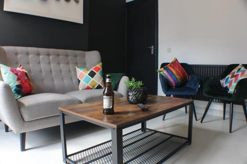 A stylish living room featuring a comfortable s...