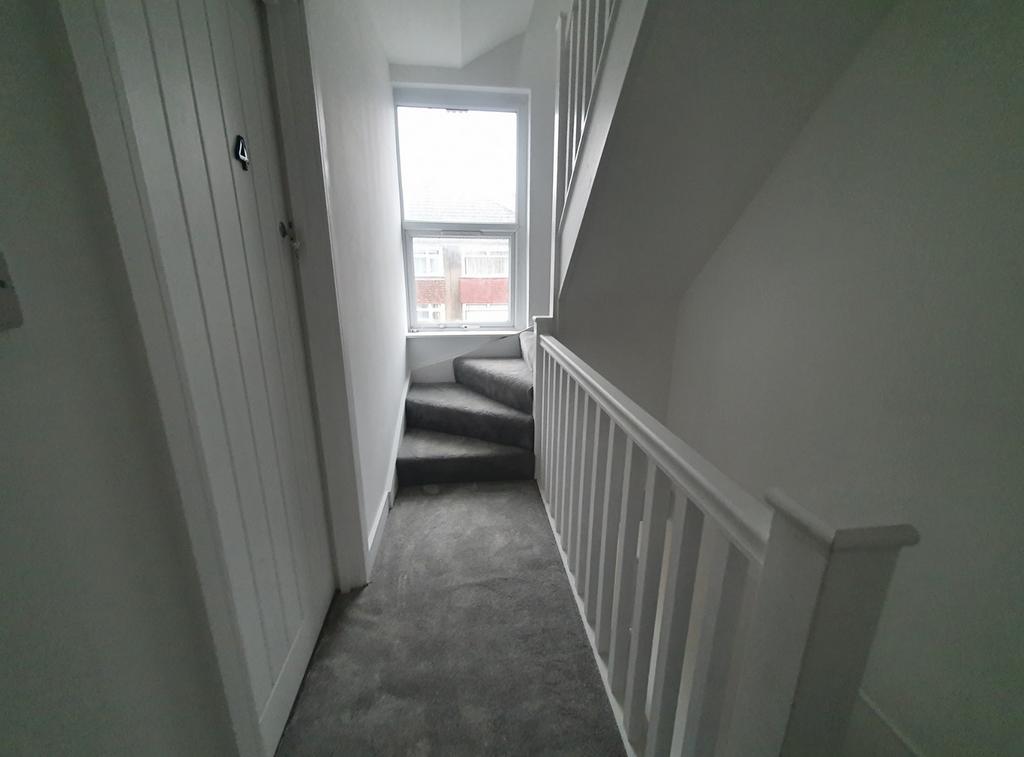 A well-maintained staircase leading to the uppe...