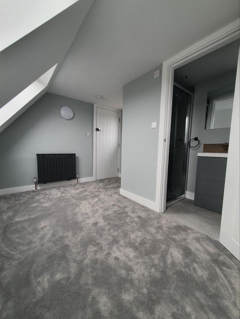 This elegant bathroom suite features modern fix...