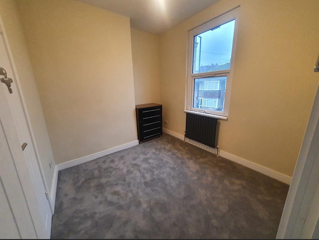 Bright and cozy double bedroom featuring a styl...