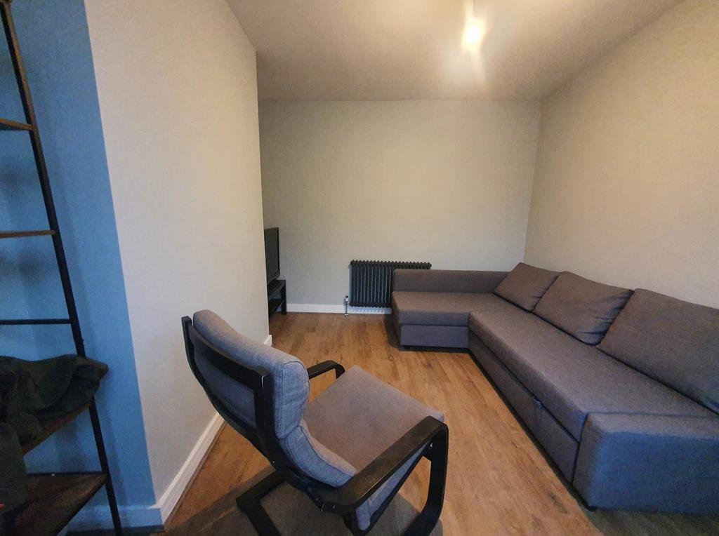This cozy living room features a comfortable se...