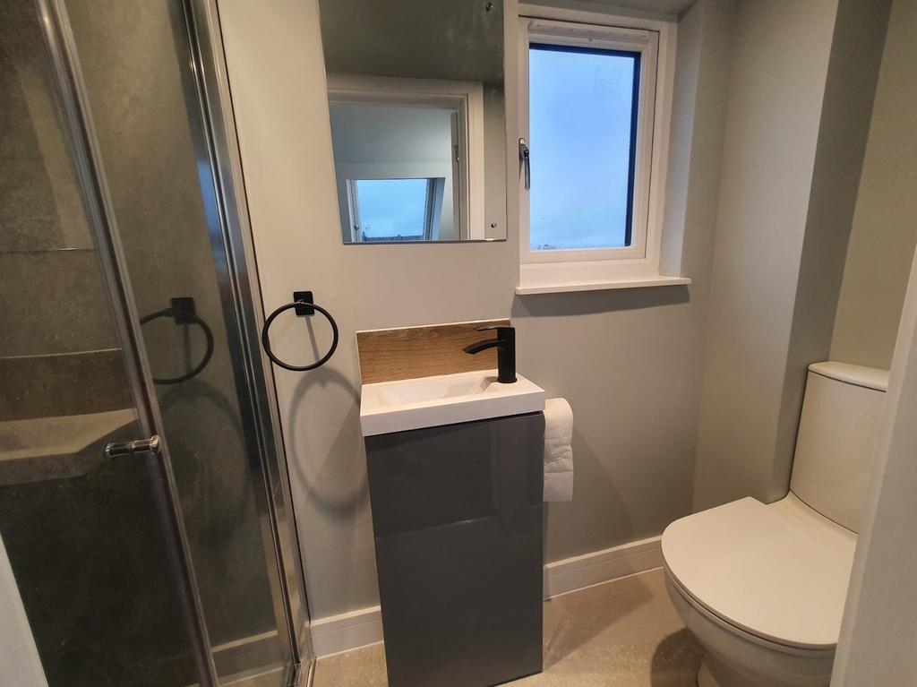 A modern bathroom featuring a sleek design with...