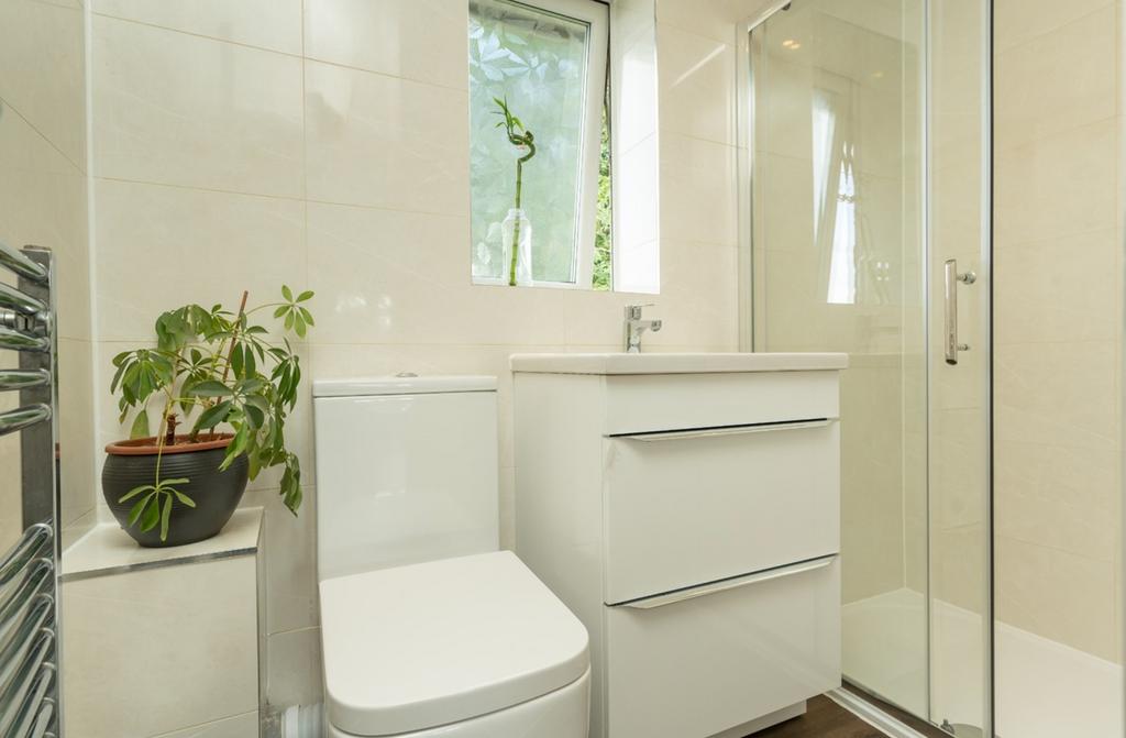 A modern and clean bathroom featuring a shower ...