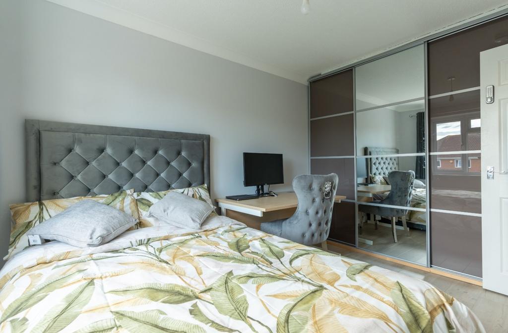 A stylish and inviting double bedroom with mode...