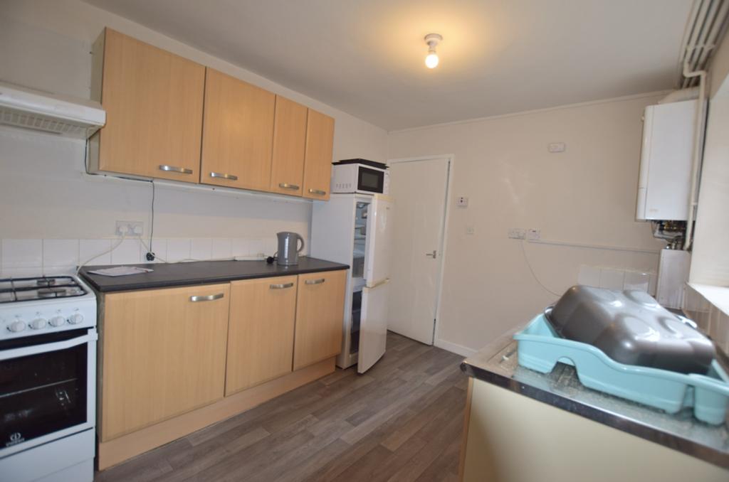 A functional and tidy kitchenette equipped with...