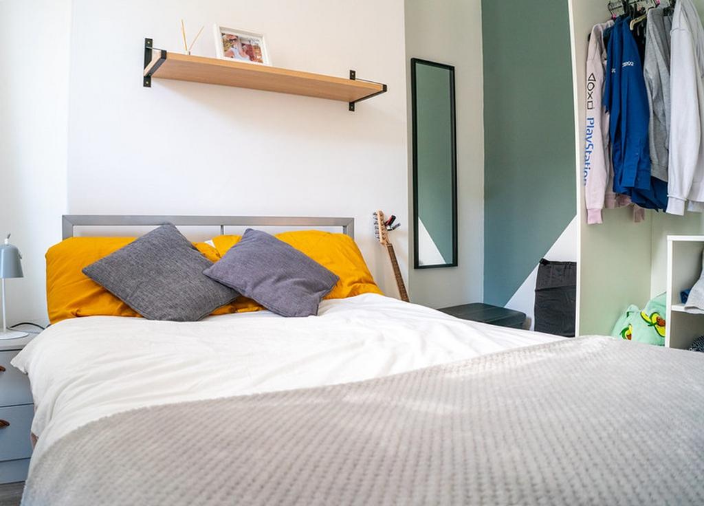 A bright and inviting double bedroom featuring ...