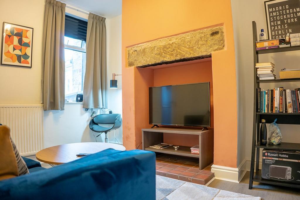 A cozy and inviting living room with ample natu...