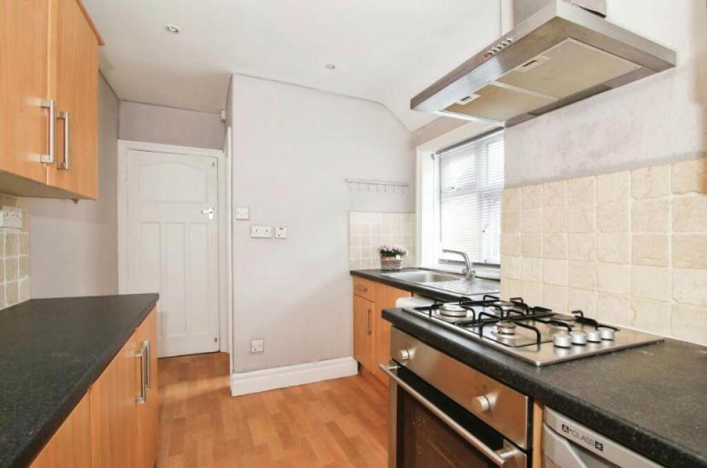 This charming kitchen features modern appliance...