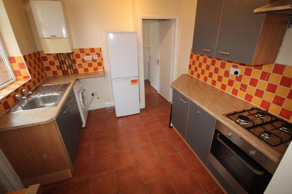 A well-equipped kitchen featuring modern applia...
