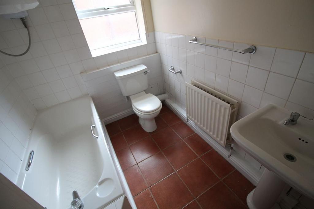 This well-maintained bathroom features a bathtu...