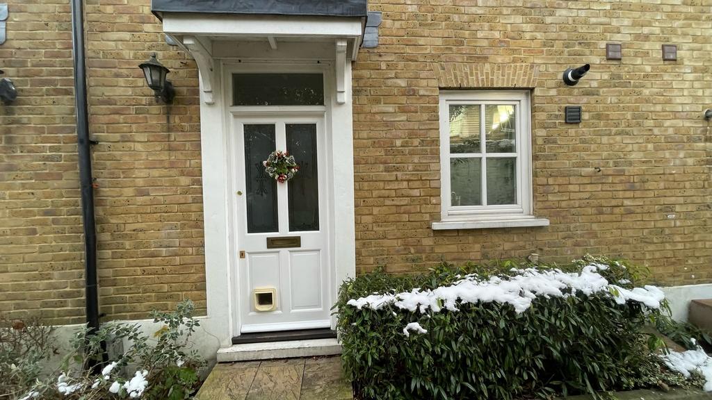 A charming entrance showcasing a well-maintaine...
