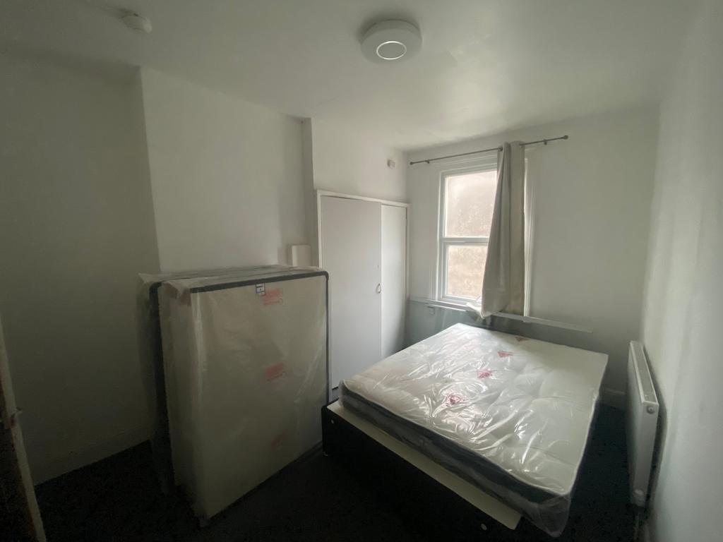A cozy double bedroom featuring a new mattress ...