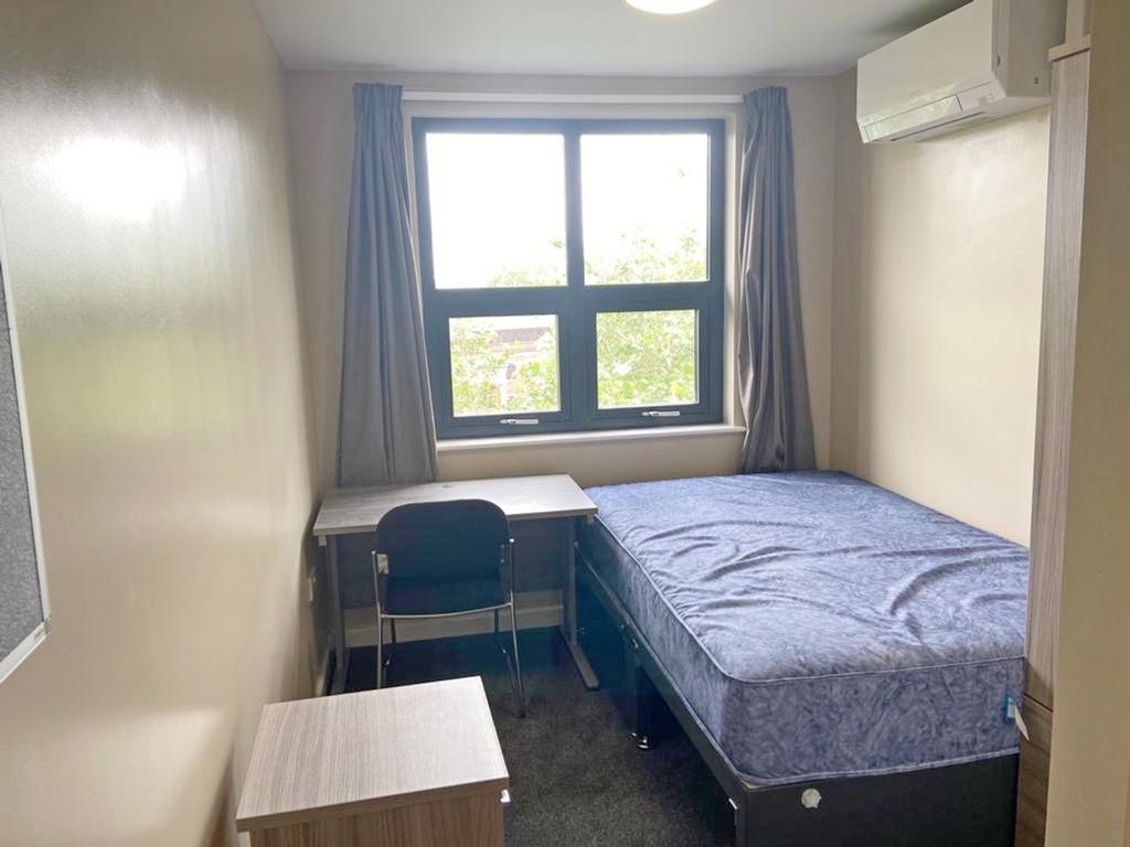 A bright and inviting double bedroom featuring ...