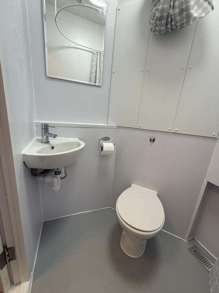 A modern bathroom featuring a clean design with...