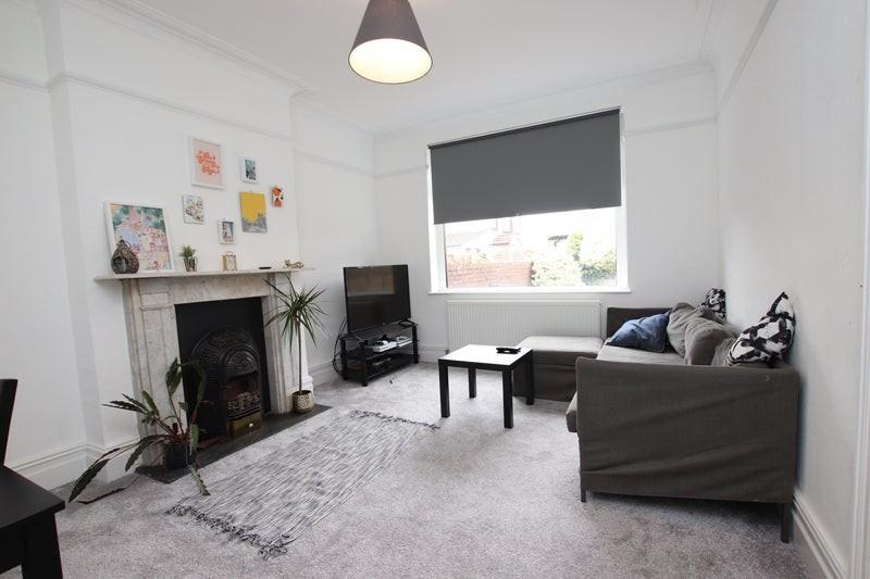 Bright and inviting living room featuring comfo...