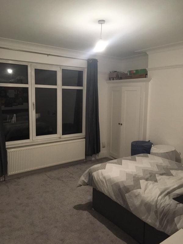 This spacious double bedroom features ample nat...