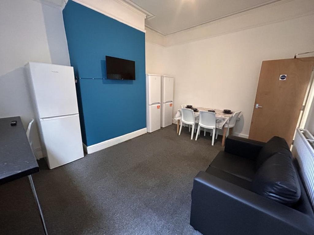 Spacious living room featuring a comfortable so...