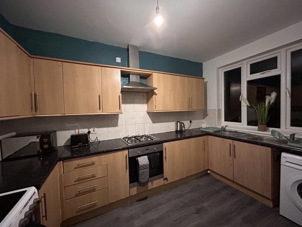 A modern kitchen featuring ample storage with w...