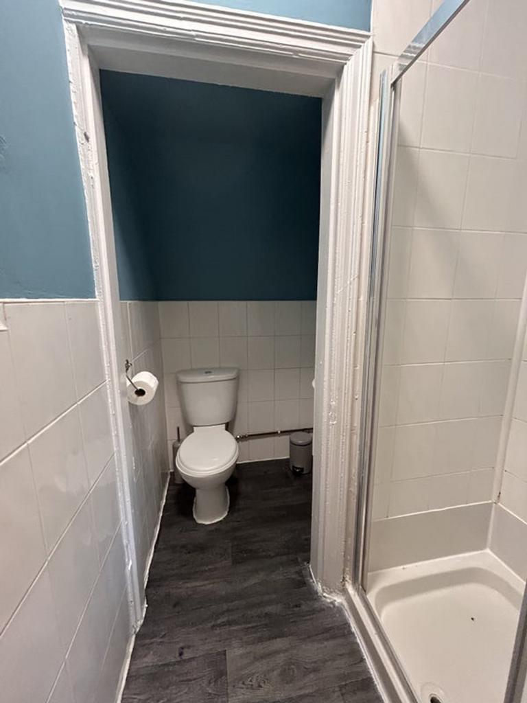A modern bathroom featuring a clean shower area...