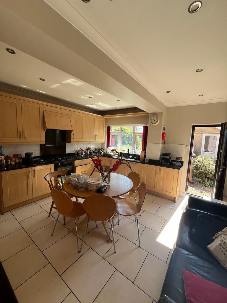This spacious kitchen features modern cabinetry...