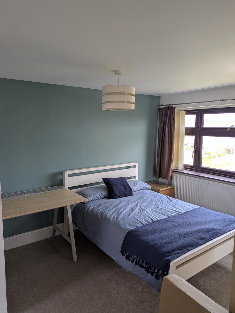 Bright and inviting double bedroom featuring a ...