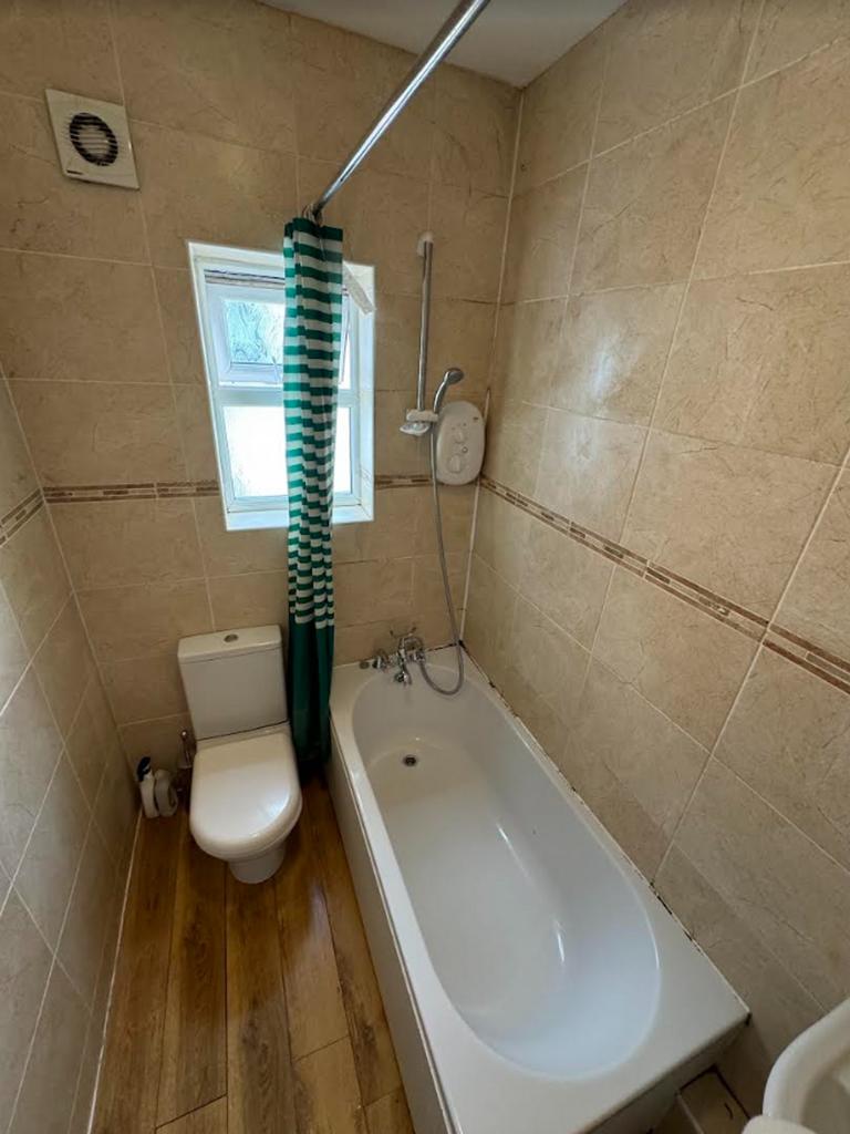 A tidy and well-maintained bathroom featuring a...