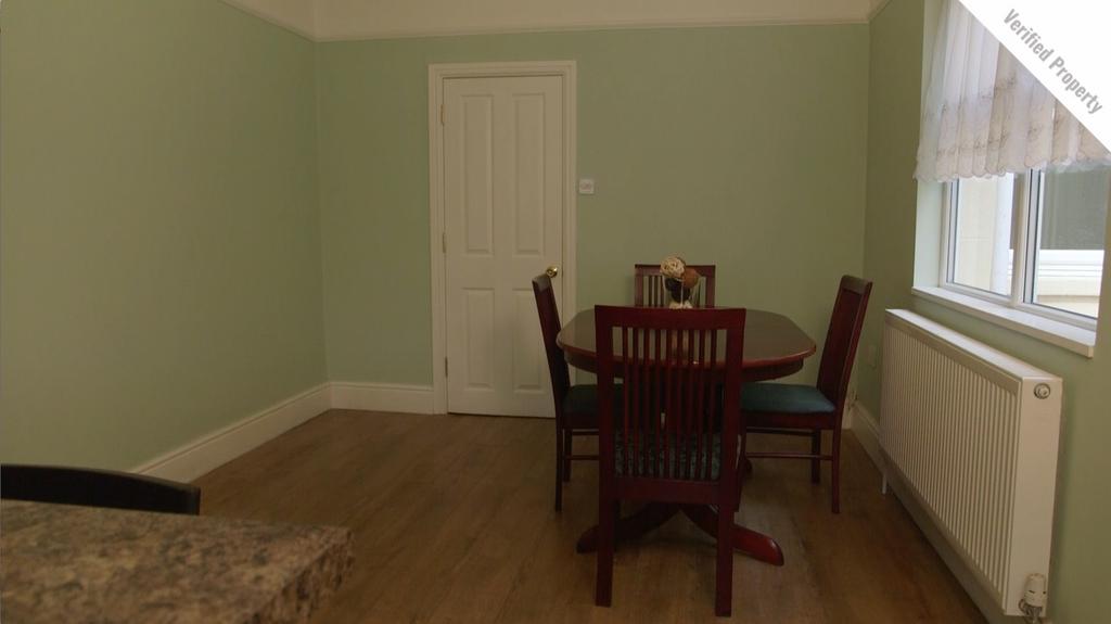 A clean and inviting kitchen area with ample sp...