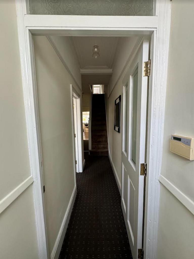 A tidy and spacious hallway that welcomes you i...