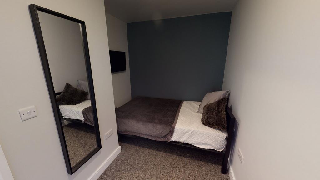 A cozy double bedroom featuring modern decor an...