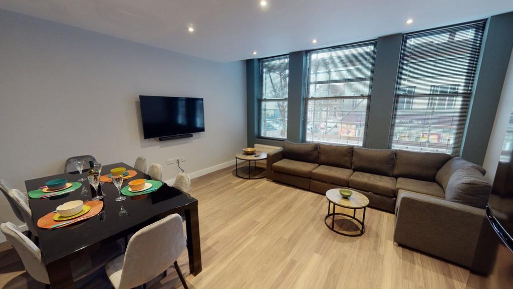A spacious and inviting modern living room, per...